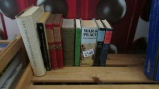 A quantity of Tolstoy books including War and Peace.