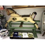 A 1950's painted wooden rocking horse.