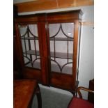 An Edwardian mahogany inlaid display cabinet.