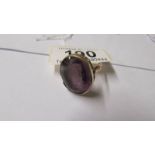 A 9ct gold and amethyst large dress ring, size O.