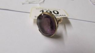 A 9ct gold and amethyst large dress ring, size O.