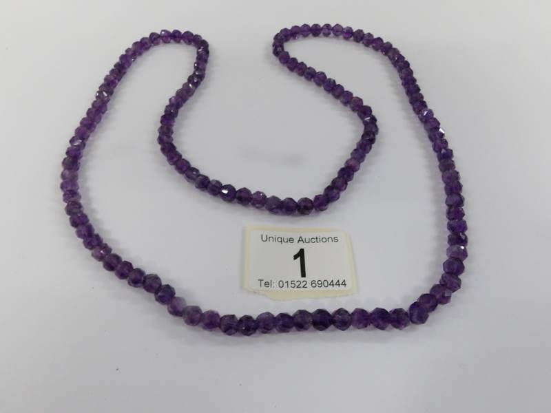 A natural amethyst long necklace.