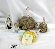 2 19th century pin cushion dolls, 2 other and a small wall mask.