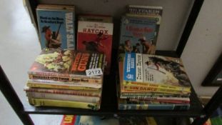 A quantity of vintage Western books.