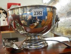 A good silver plate punch bowl with ladle.