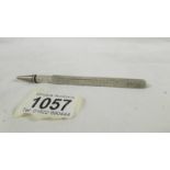 An Asprey hall marked silver (marks rubbed) 'patent' ruler/pencil, ruler extends to 9",