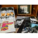 A framed and glazed Beatles plaque, Beatles books etc.