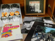 A framed and glazed Beatles plaque, Beatles books etc.