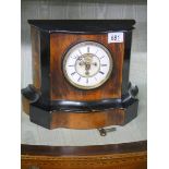 An open escapement chiming mantel clock in good working order but missing glass to front.
