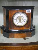 An open escapement chiming mantel clock in good working order but missing glass to front.