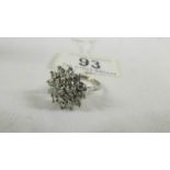 A 18ct floral diamond ring of 1.5 carats, size L half.