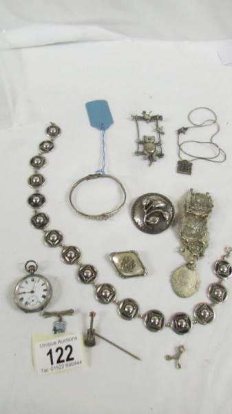 A silver fob watch, a silver bangle and further jewellery items.