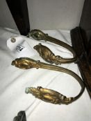 A pair of antique brass curtain tie backs.