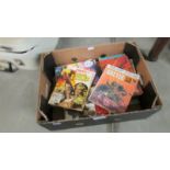 A box containing 60 war and battle Fleetway Picture Library comics.
