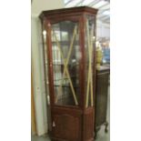 A good quality glazed corner cabinet.