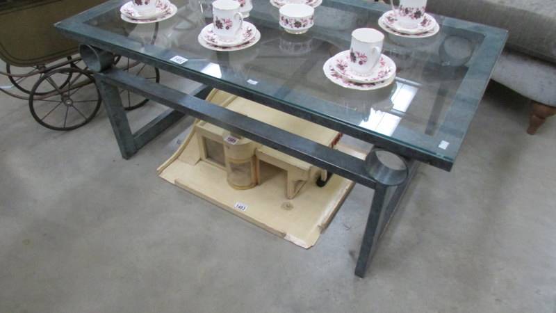 A glass and metal coffee table.