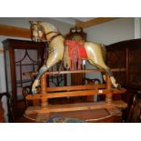A Victorian rocking horse on pine frame. ****Condition report**** Frame 126.