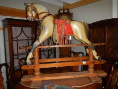 A Victorian rocking horse on pine frame. ****Condition report**** Frame 126.