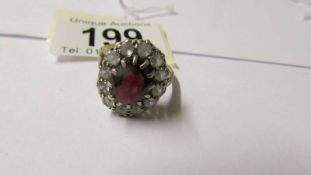 A 9ct gold garnet dress ring, size T.