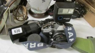 A Praltica camera with 1500A flash gun and a long lens.