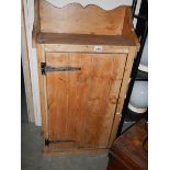 An old pine single door cupboard.