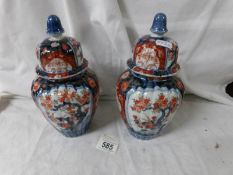 A pair of oriental lidded jars (1 lid a/f).