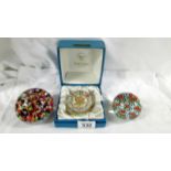 A Strathern glass millifiori paperweight and 2 others.