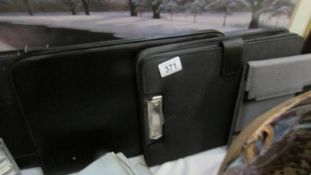4 attache' cases and a writing case.
