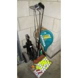 A golf trolley, golf clubs, golf ball, tennis raquets etc.