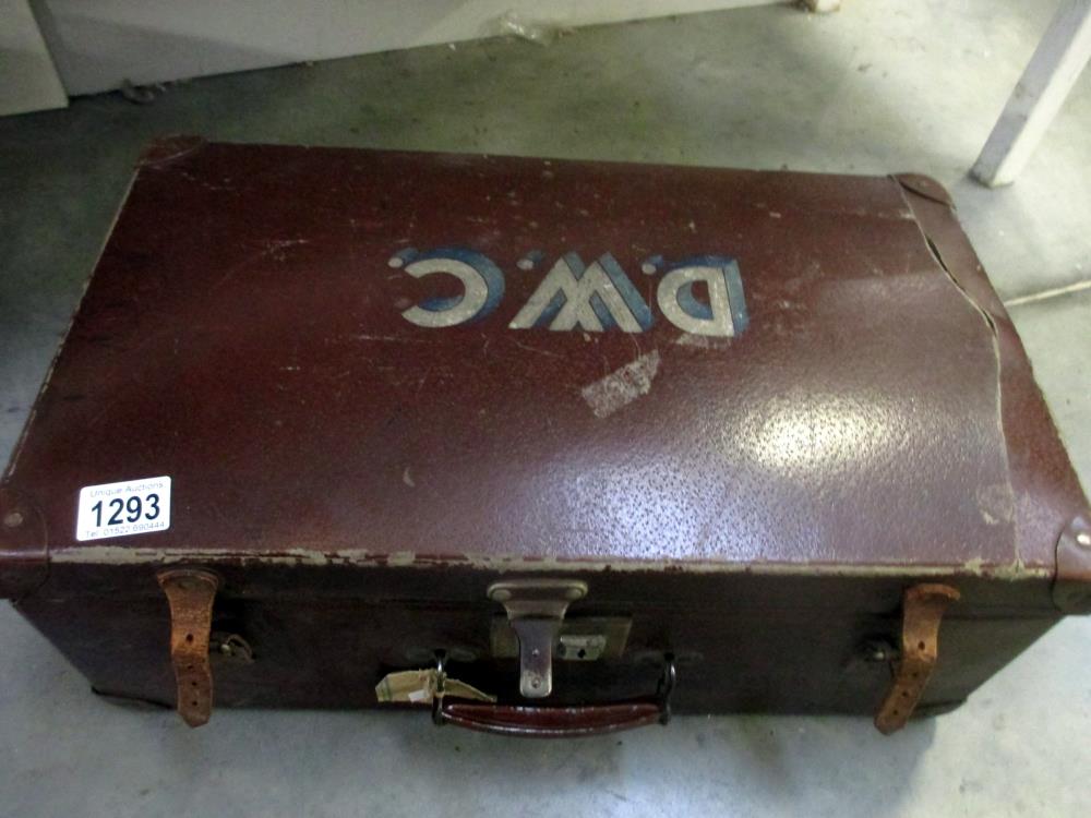 A vintage suitcase with painted D.W.C.