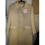 A Worth of London vintage cream coat.