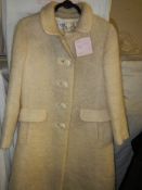 A Worth of London vintage cream coat.