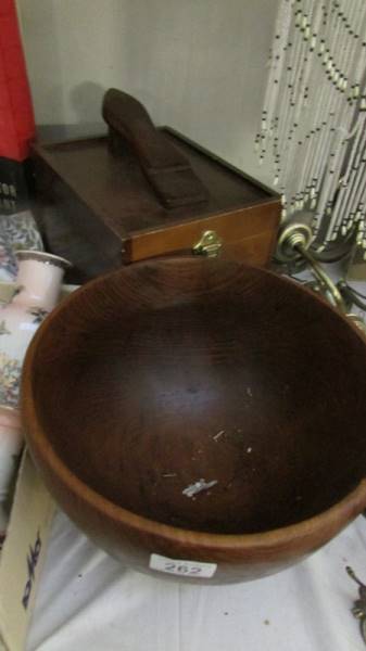 A wooden bowl and a wooden shoe cleaning box.