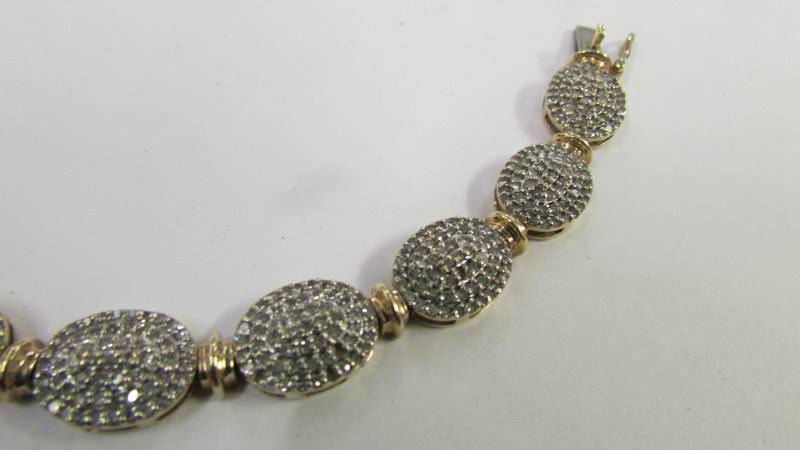 A 9ct gold and diamond bracelet. - Image 2 of 4