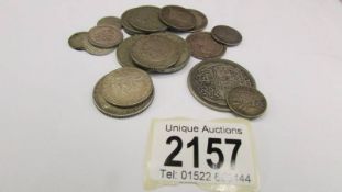 18 foreign silver coins, approximately 103 grams.