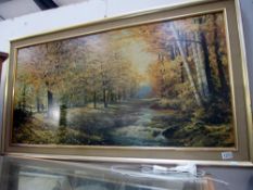 A large framed print of woodland scene & river, by Robert Wood,