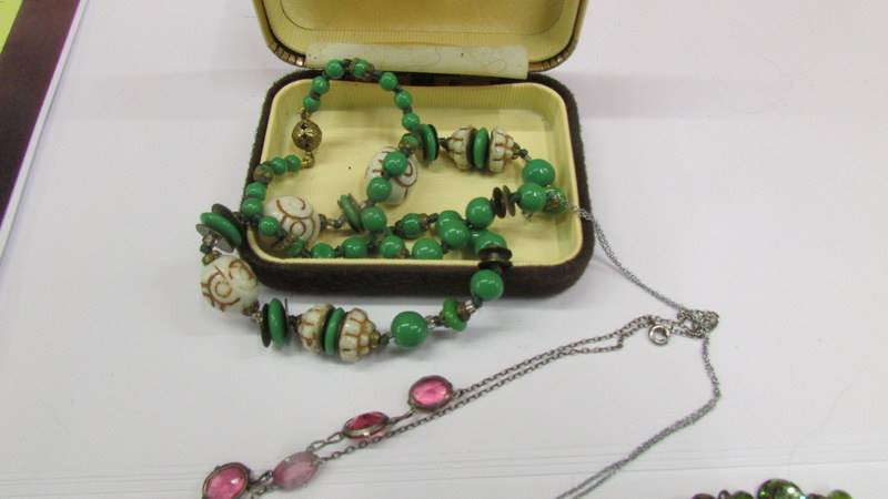 Four vintage necklaces together with three silver vintage brooches and 3 silver rings. - Image 2 of 4