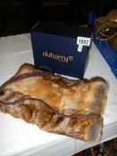 A Dubarry of Ireland faux fur muff in original box.