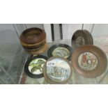 Five framed pot lids and 4 pot lid frames.