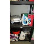 A mixed lot of household items including irons, grill, pressure cooker.