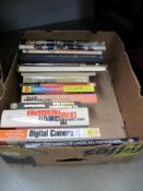A box of photographic books etc.