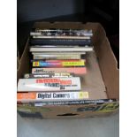 A box of photographic books etc.