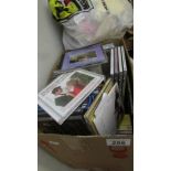 A box of assorted CD's.