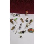 A quantity of novelty bottle stoppers, poodle pin cushion etc.