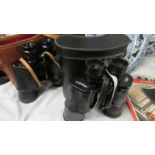 2 cased binoculars - 1 x Omega and 1 x USSR.