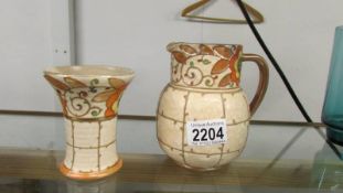 A Charlotte Rhead jug and small vase.