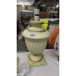 A table lamp base in the shape of an urn.