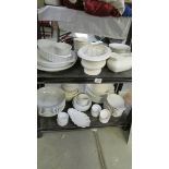 2 shelves of white plates etc.