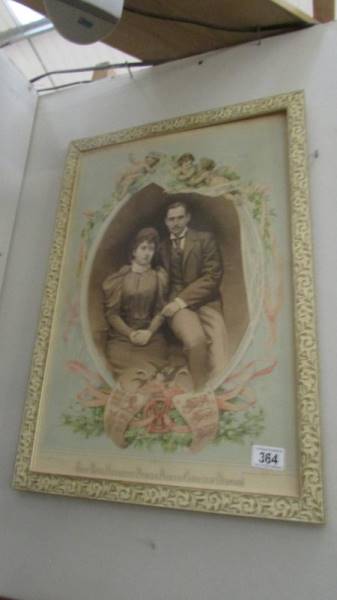 A framed picture of Prince and Princess Charles of Denmark.