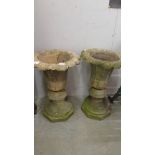 A pair of "stoneware" garden urns, a/f.